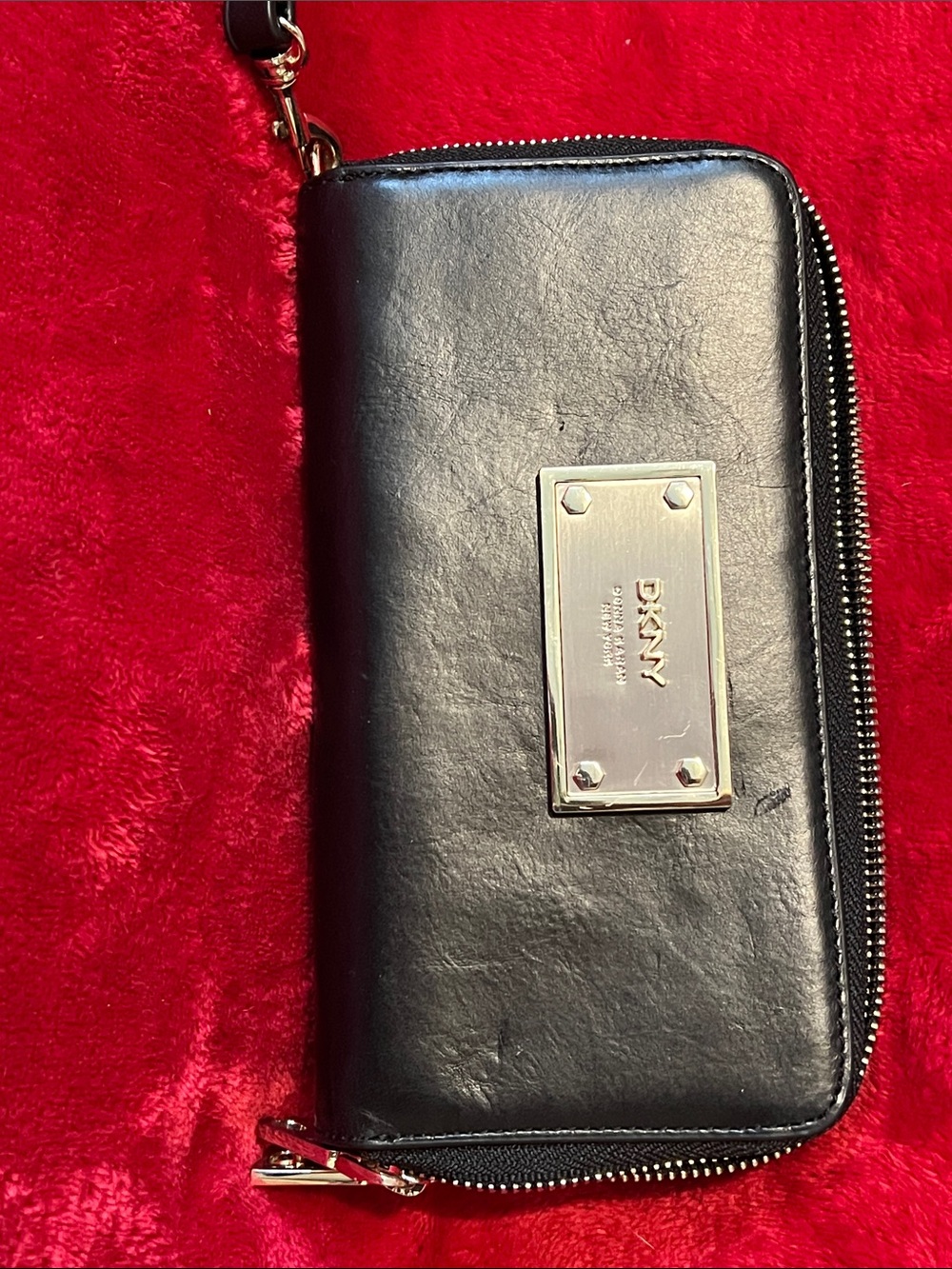 DKNY Black Leather Zip-Around Wristlet with Gold Logo Plate